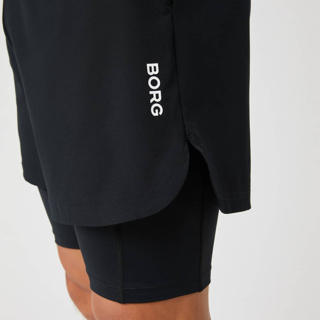 Black shorts with "BORG" written in white, featuring a layered design over black compression shorts.
