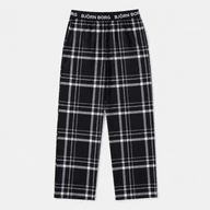 Plaid pajama pants with elastic logo waistband.