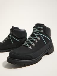 Black hiking boots with light blue laces, padded ankle support, and rugged soles, displayed on a light background.