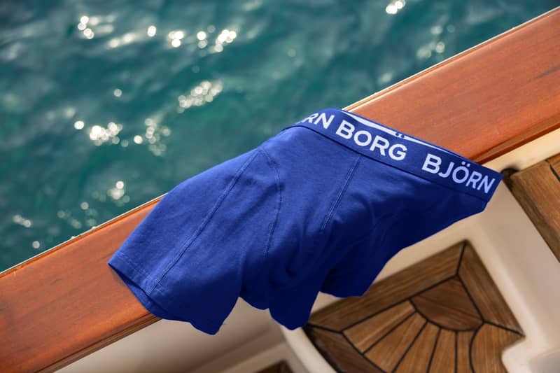 Blue boxer briefs placed on a wooden surface