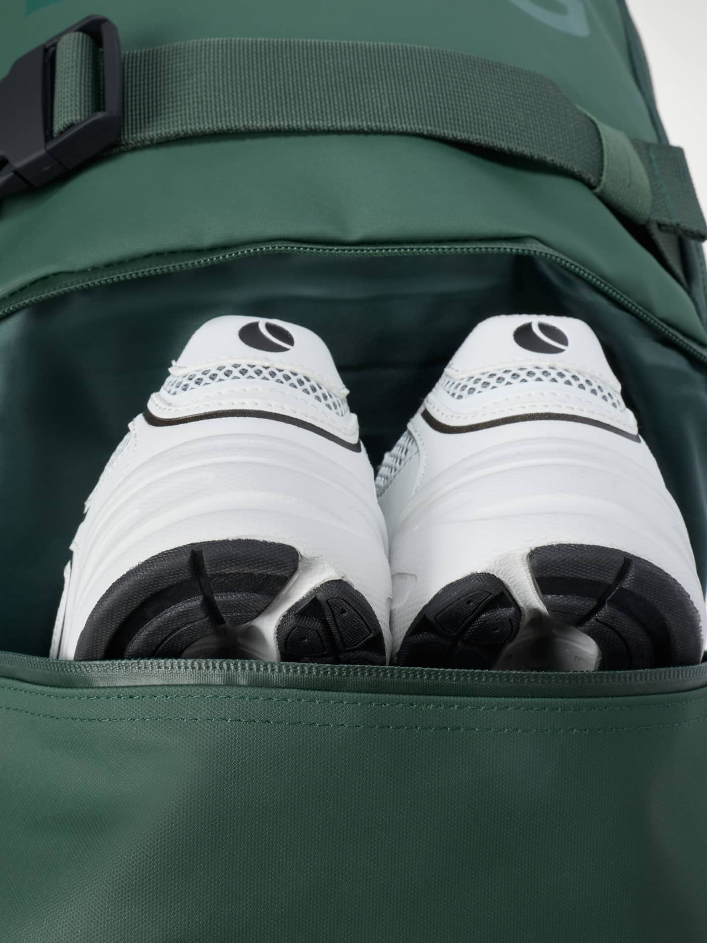 Borg Duffle Backpack 28L in MOUNTAIN VIEW (Green) with a tonal logo, showing training shoes in the shoe pocket. - Image 3