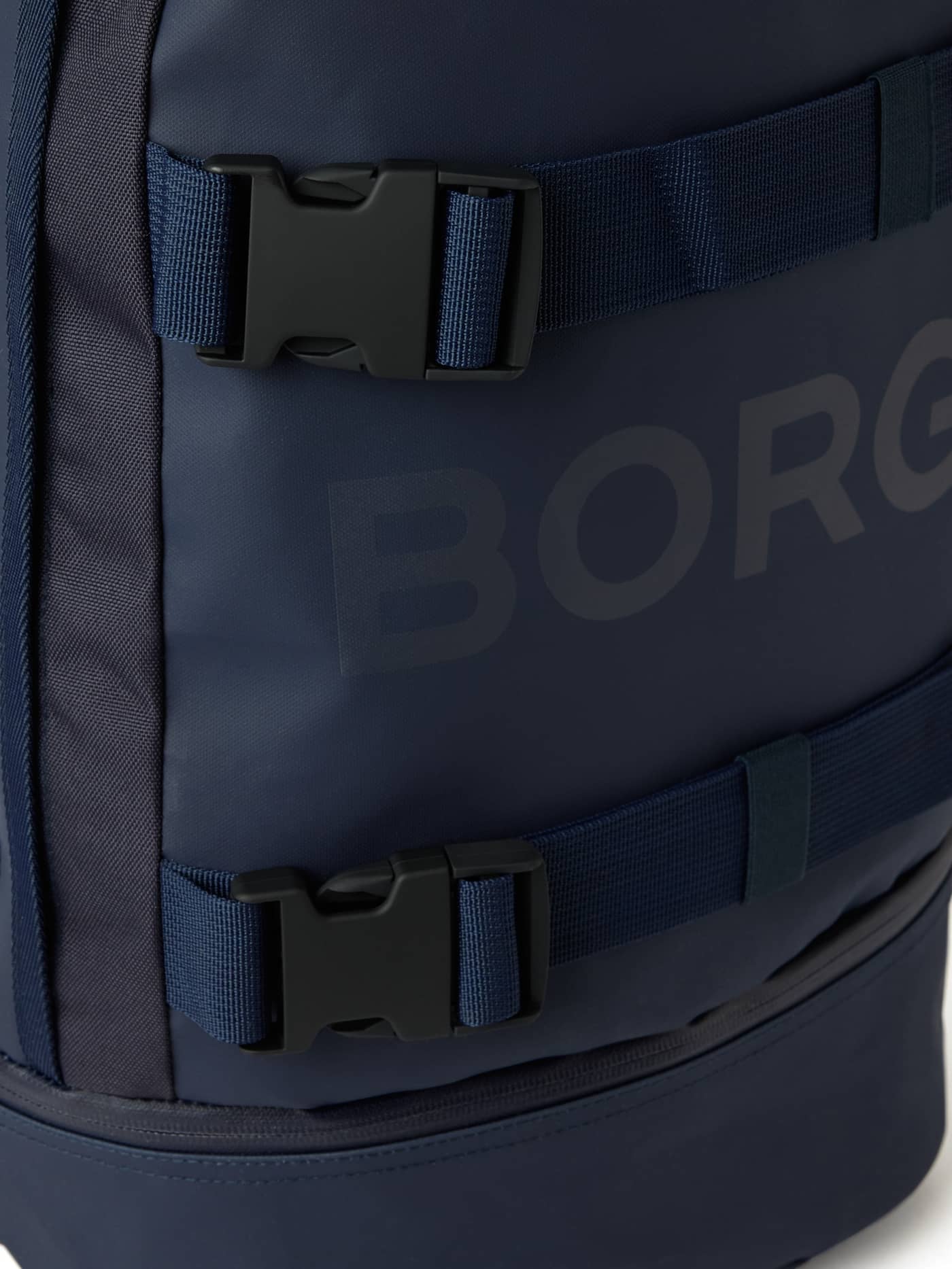 Detailed close-up of the Borg Duffle Backpack 28L in Night sky (Navy) with the BORG logo and buckles for training gear. - Image 3