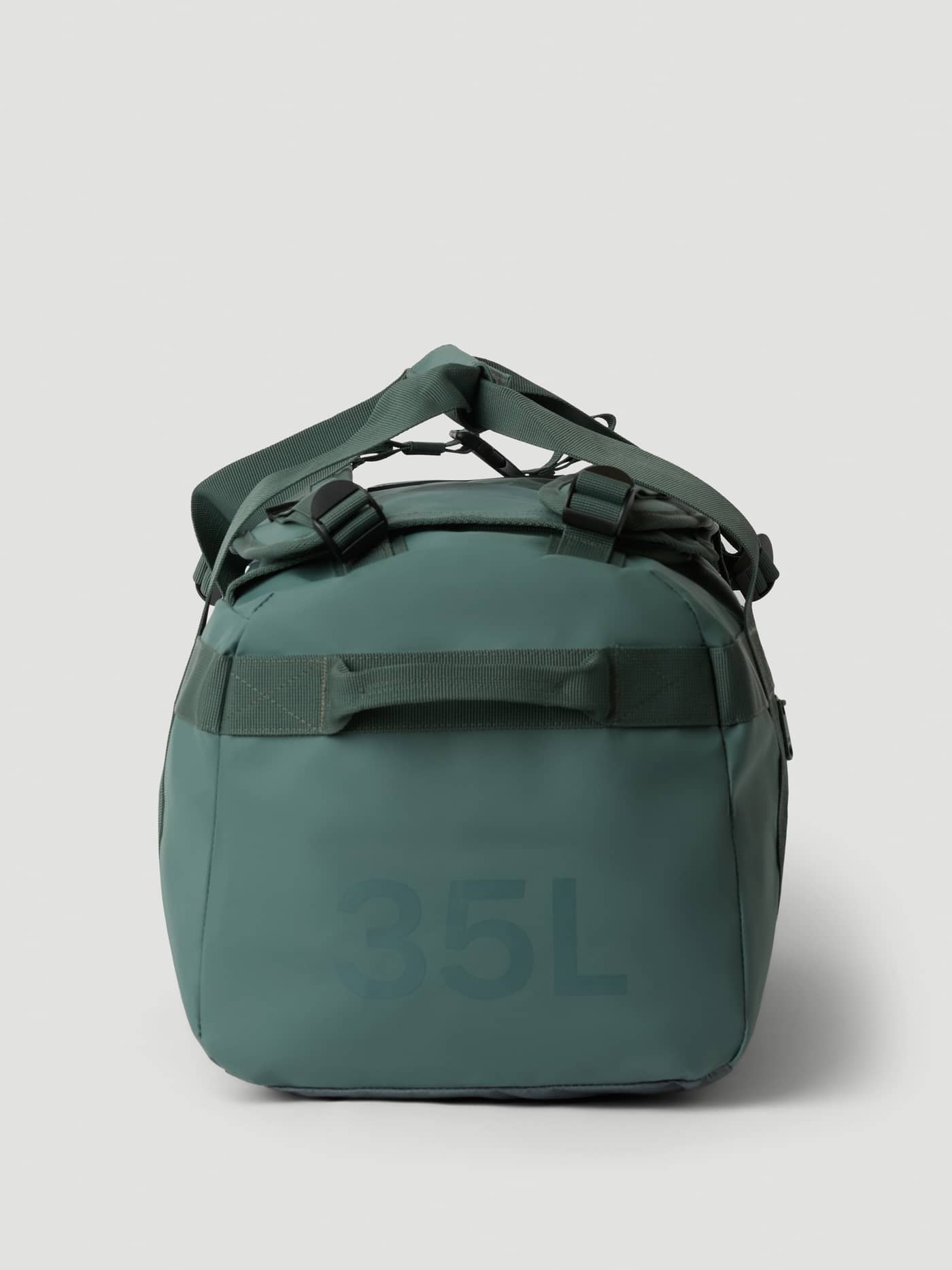 Side view of the Balsam Green (Green) Borg Duffle Bag 35L, highlighting its sturdy TPE coating and 35L side print. - Image 4