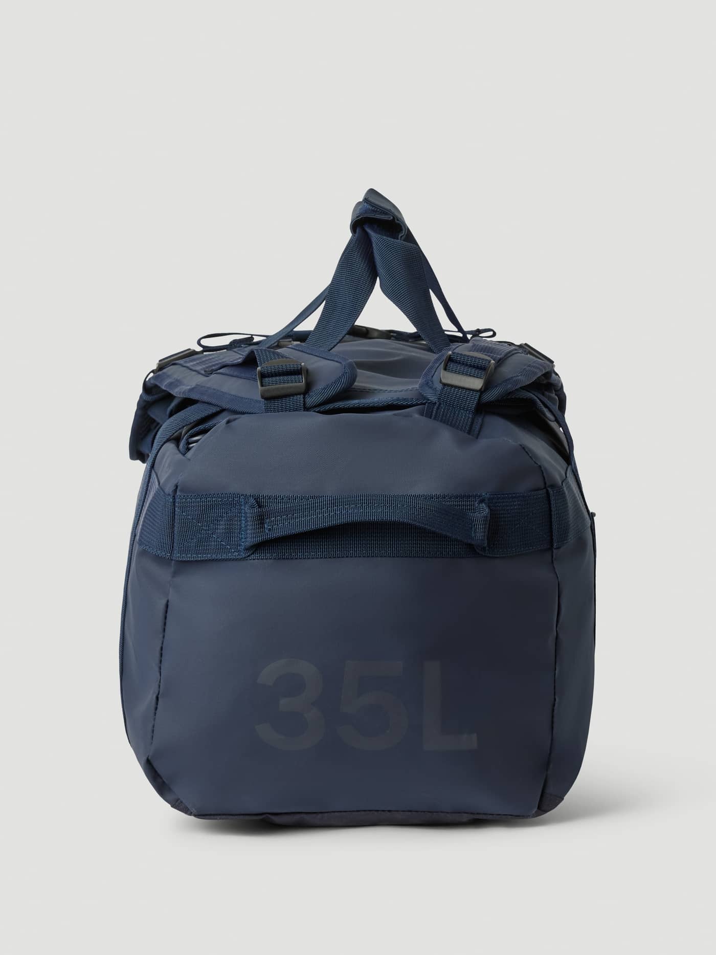 Side view of the Borg Duffle Bag 35L in Night sky (Navy), showcasing the durable coated material and 35L logo. - Image 5