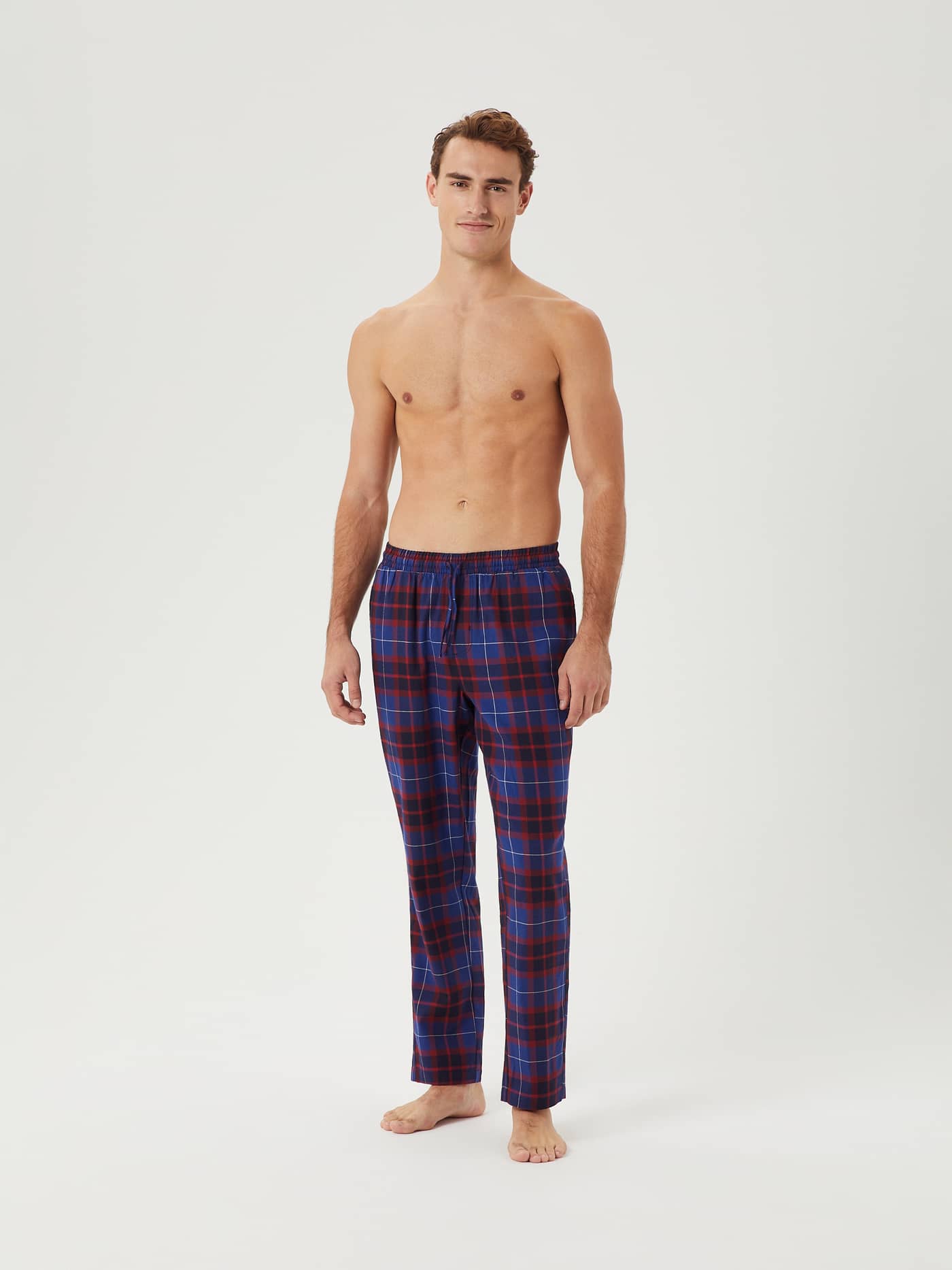 Front view of a model wearing the Björn Borg Core Flannel Pyjama Pants in a blue and red tartan pattern. - Image 3