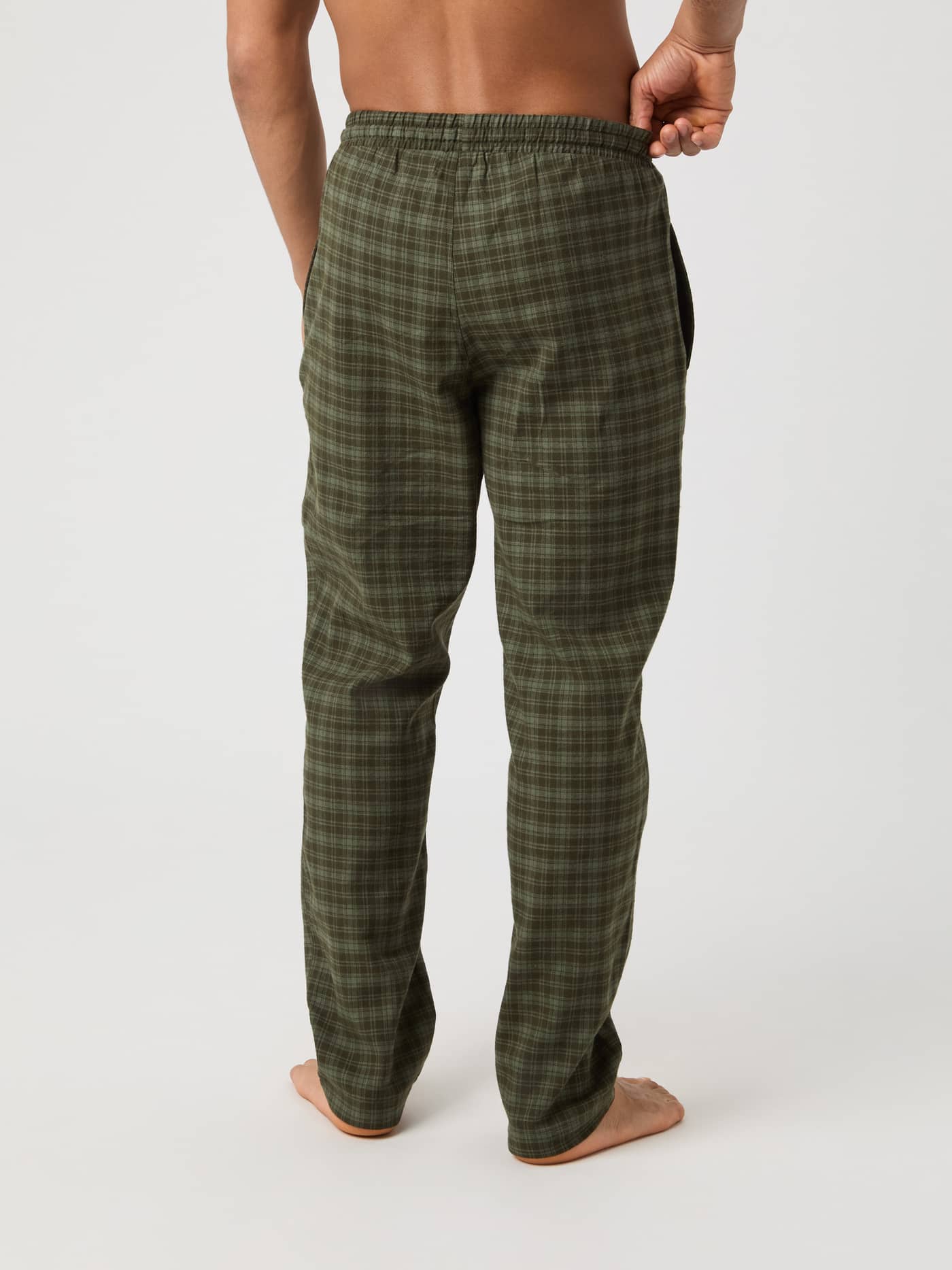 Model seen from the back wearing the green checked Core Flannel Pyjama Pants. - Image 3