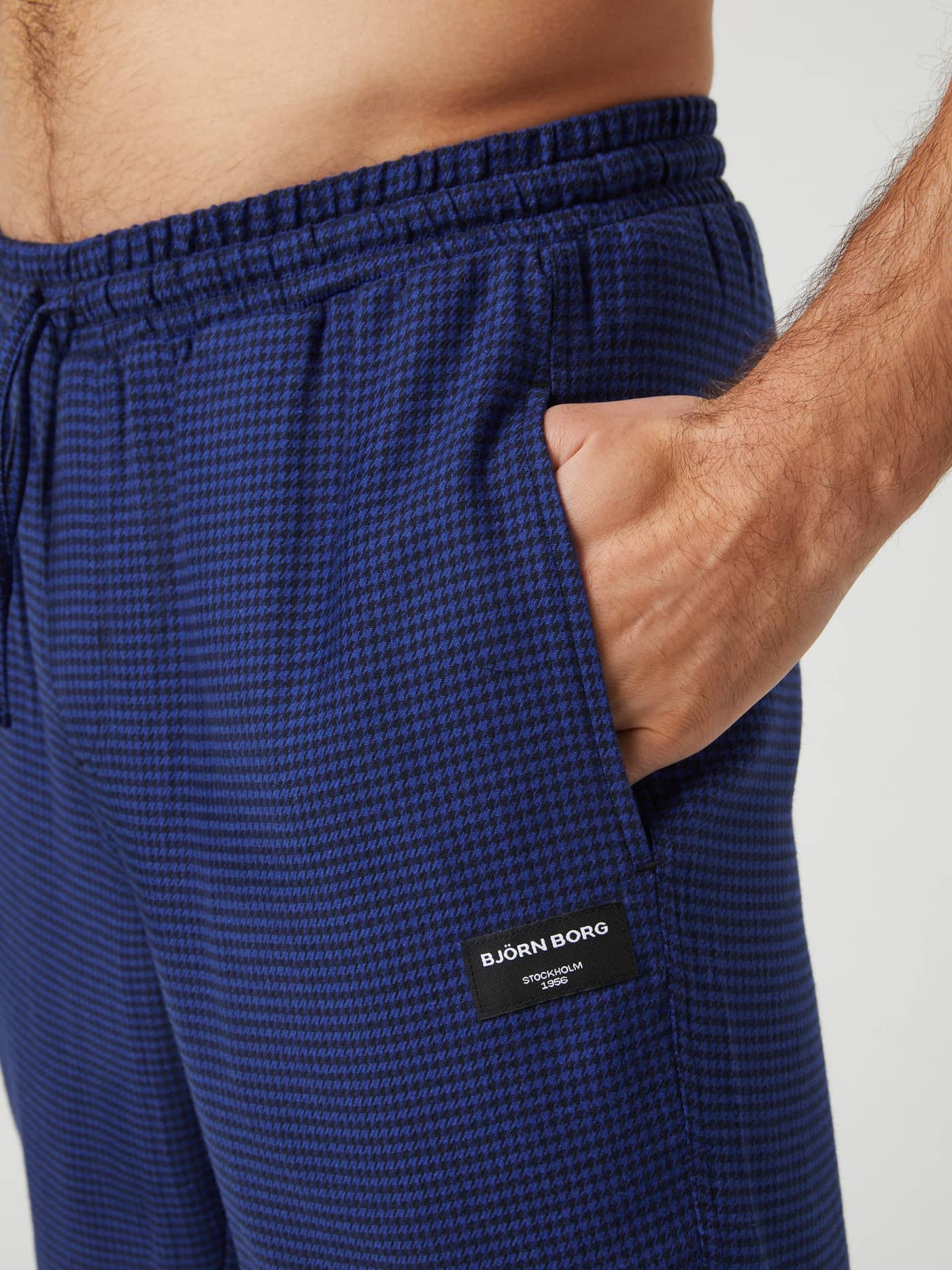 Close-up of Björn Borg Core Flannel Pyjama Pants in a blue houndstooth pattern, showing the side pocket and elastic waist. - Image 4