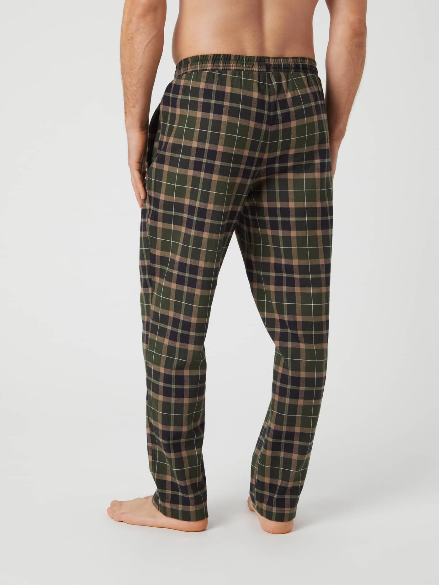 Back view of a model wearing Björn Borg Core Flannel Pyjama Pants in a green Gaelic Tartan pattern. - Image 2