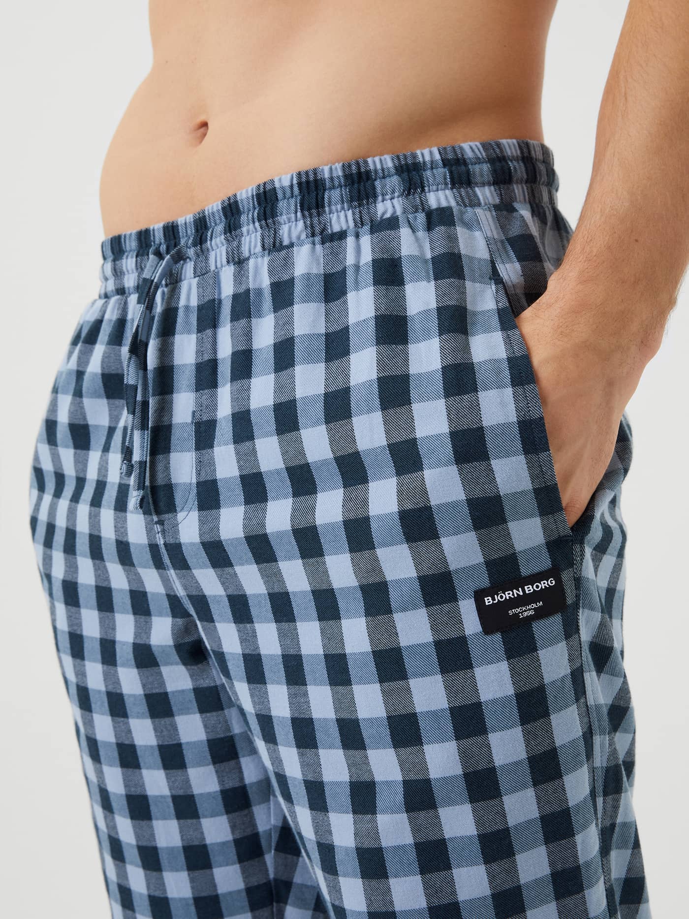 Close-up of the Björn Borg Core Flannel Pyjama Pants waist, showing the blue check pattern, drawstring, and side pocket. - Image 4