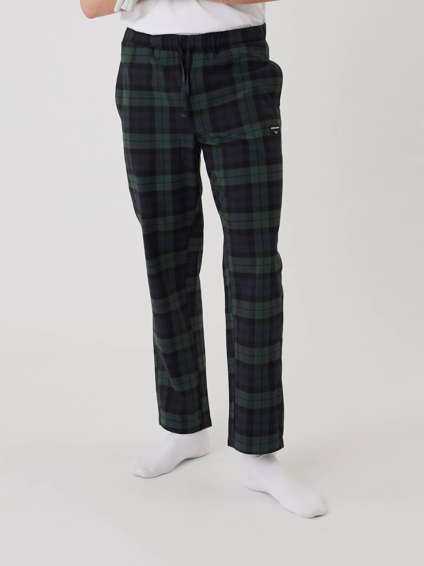 Front view of a model wearing Björn Borg Core Flannel Pyjama Pants in green and navy tartan. - Image 4