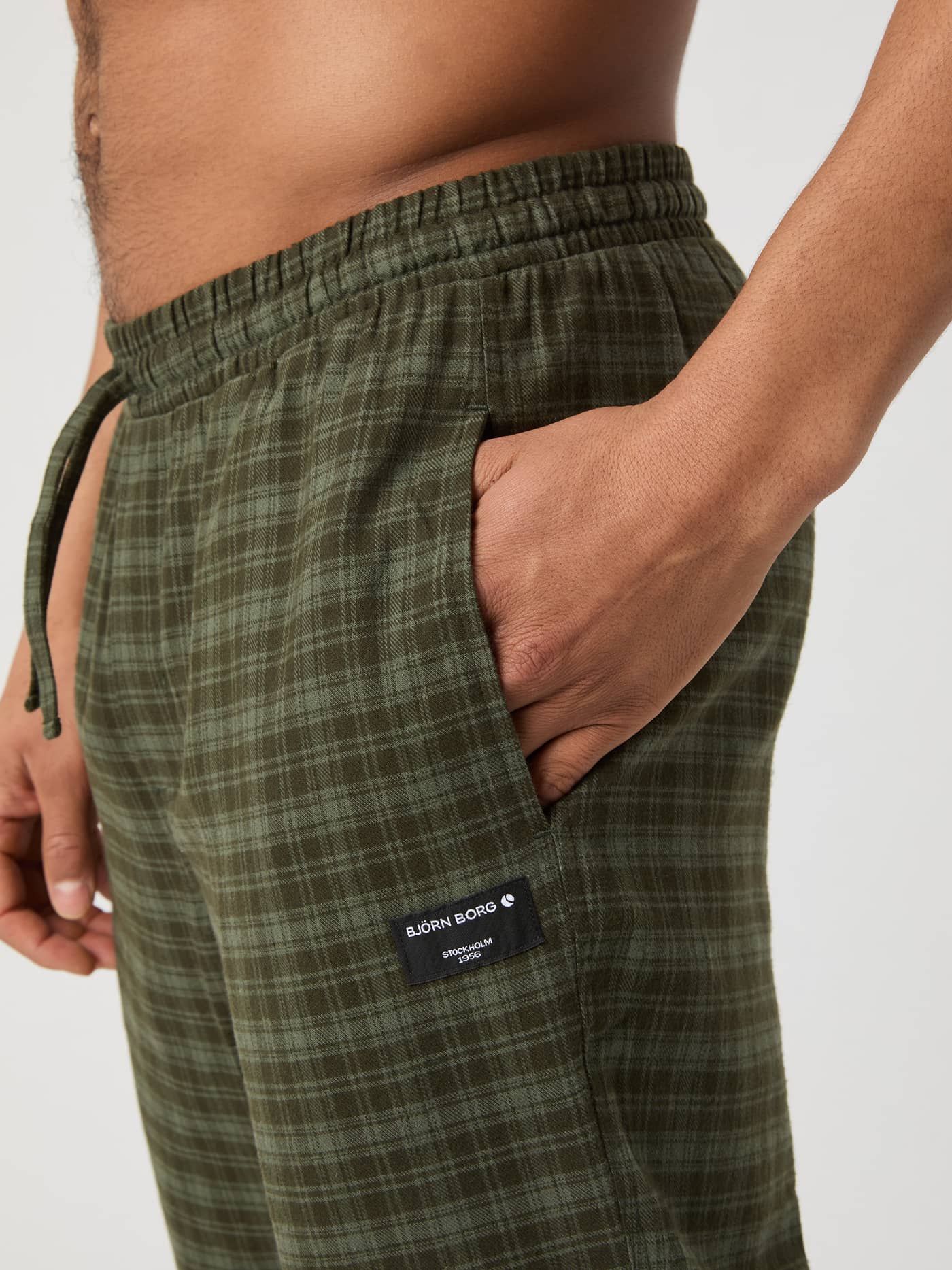 Close-up of the Björn Borg Core Flannel Pyjama Pants in green check, showing the side pocket detail. - Image 4