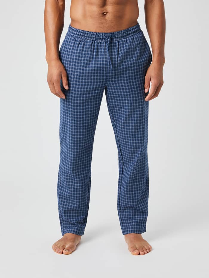 Front view of a model wearing the Björn Borg Core Flannel Pyjama Pants in a blue multicheck pattern.