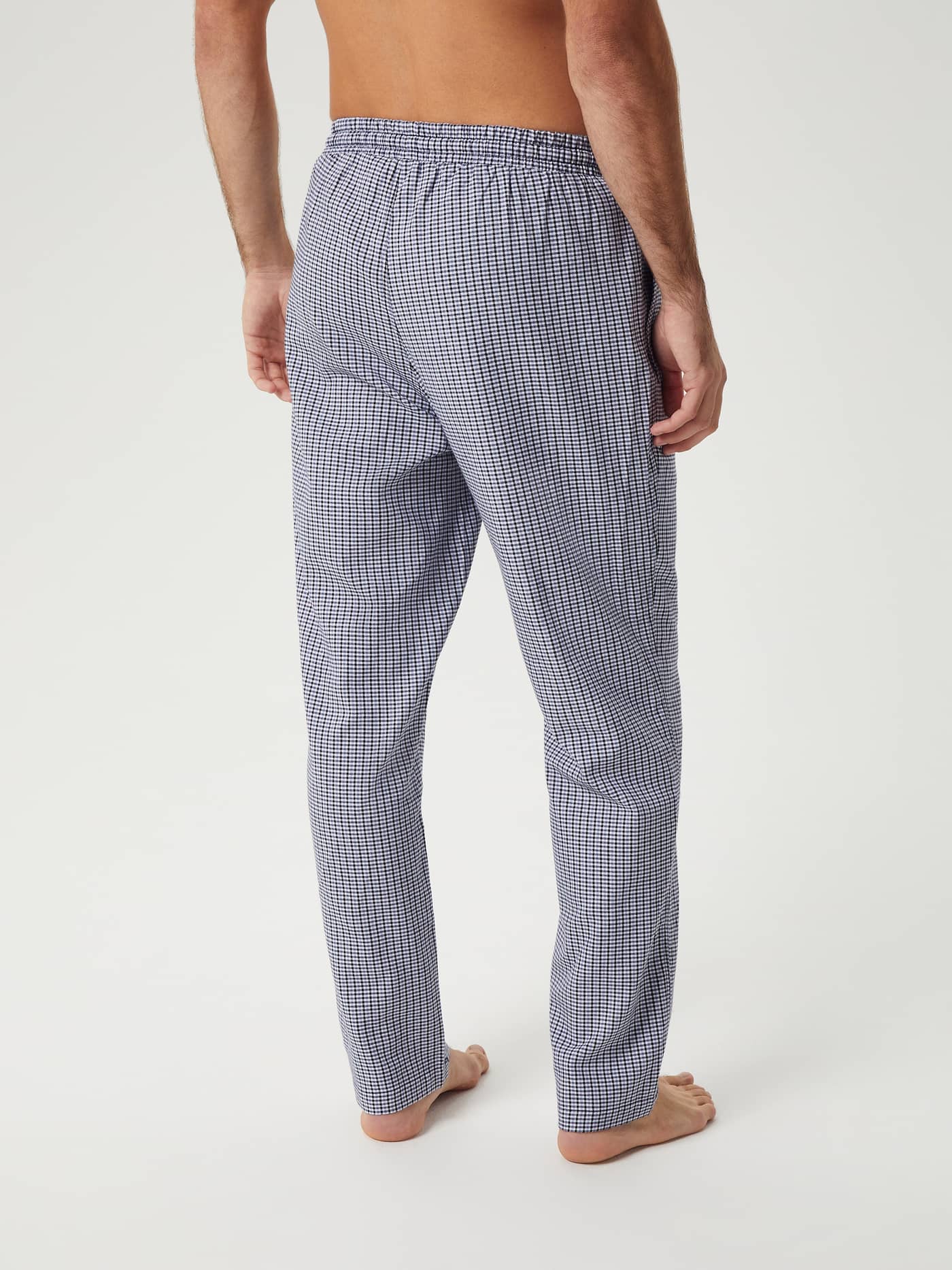 Back view of a model wearing the Björn Borg Core Flannel Pyjama Pants in a blue and white check pattern. - Image 3