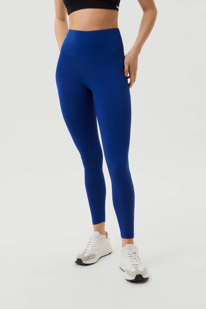 Front view of the stylish, high-waist Borg Logo Tights in Sodalite Blue (Blue) with a tonal logo for performance training. - Image 2