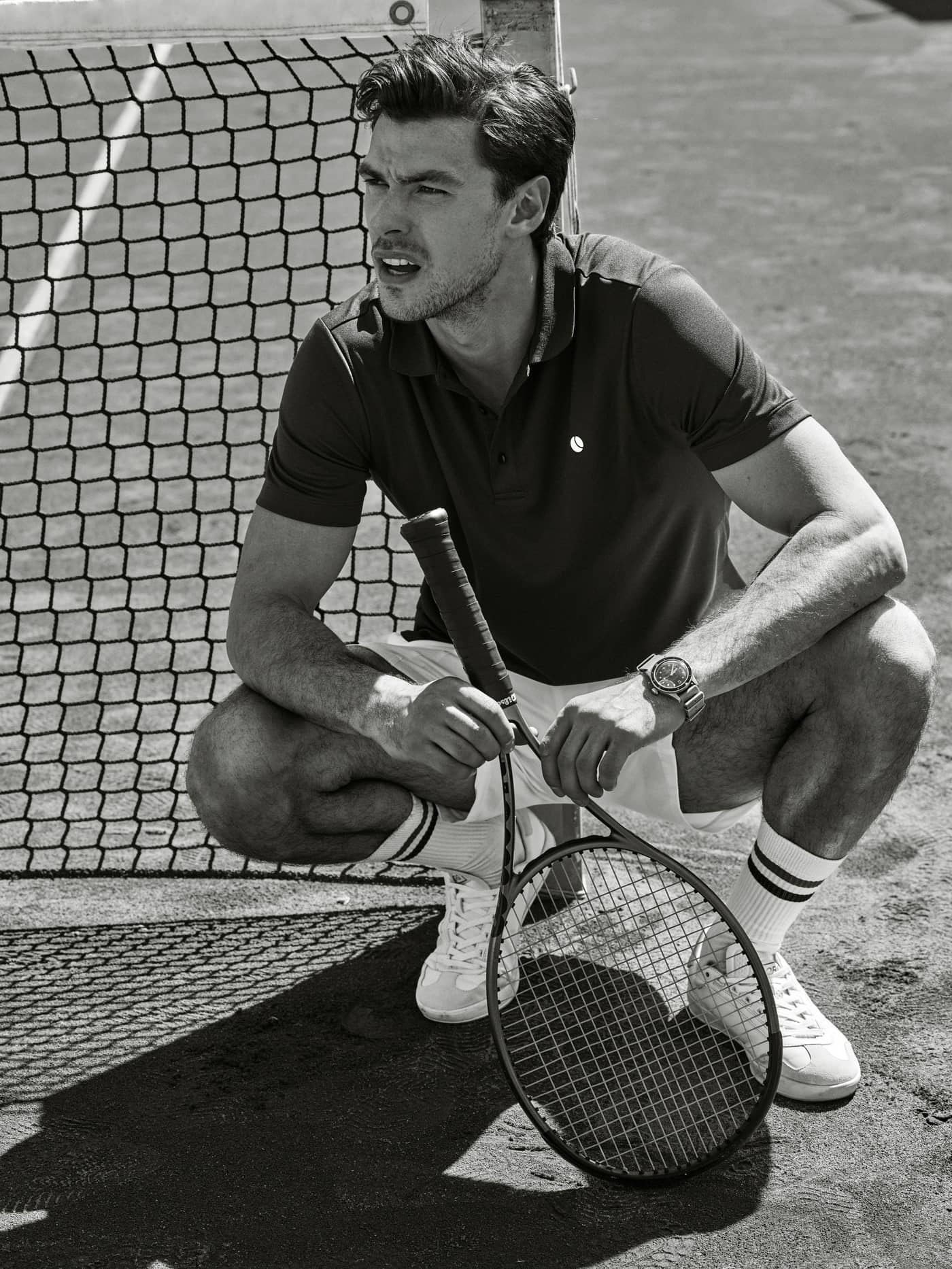 Man on a tennis court wearing the Björn Borg Core Crew Socks 3-pack in white with athletic stripes. - Image 2