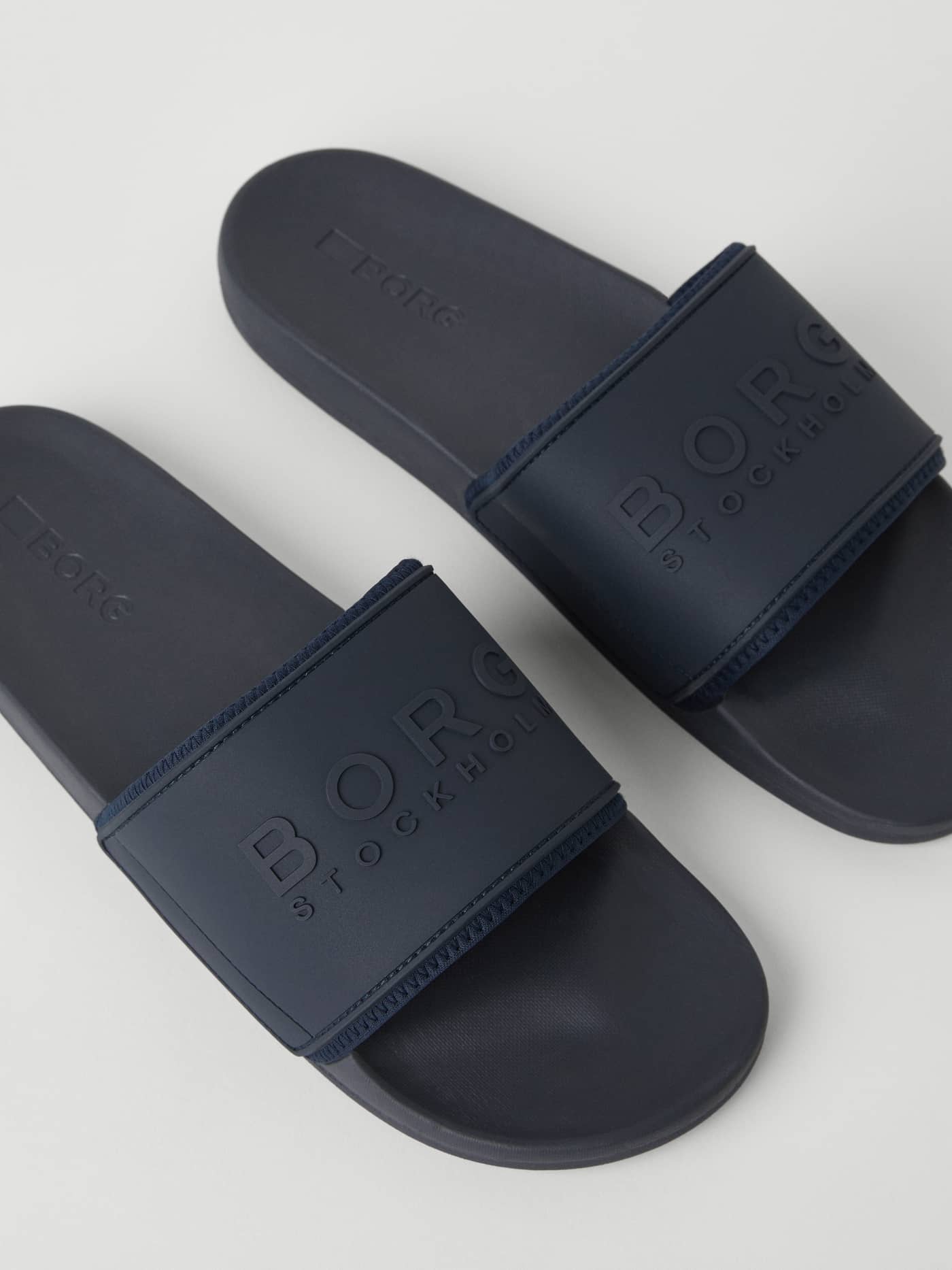 Navy Men’s Sandal Romeo Logo pool slides featuring a navy TPU strap, navy logo, and EVA outsole for style and function. - Image 2