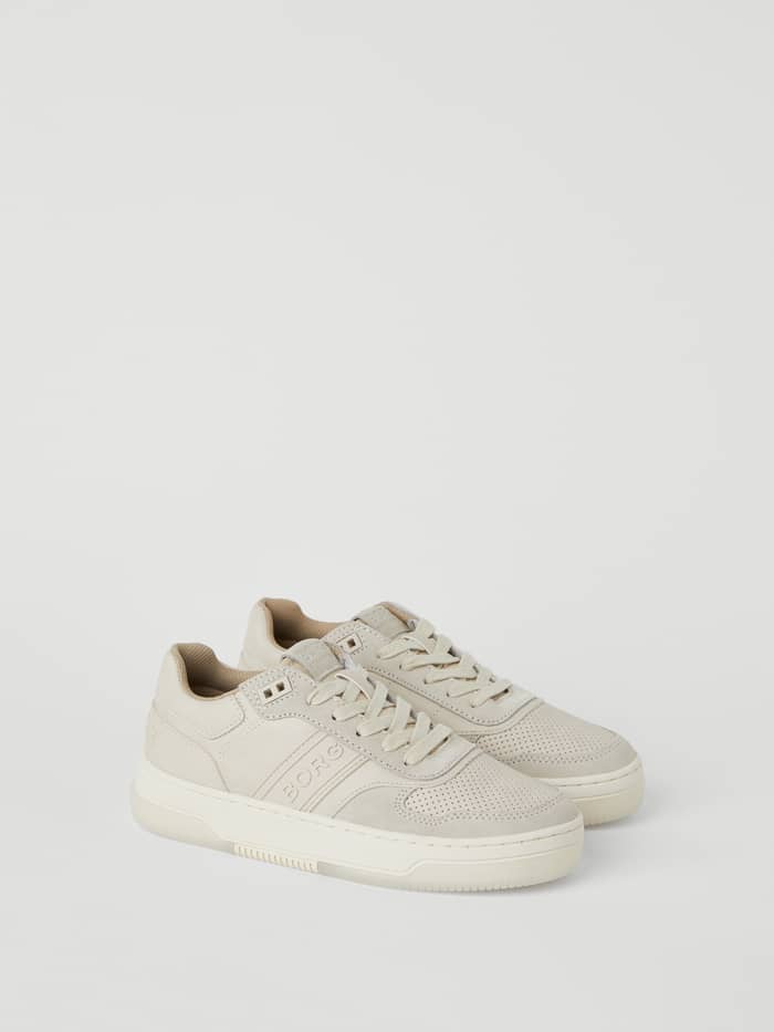 Seitenansicht der beigen Women's Sneaker T2300 Tnl im stylischen Tennis-Look mit Obermaterial aus Kunstleder.