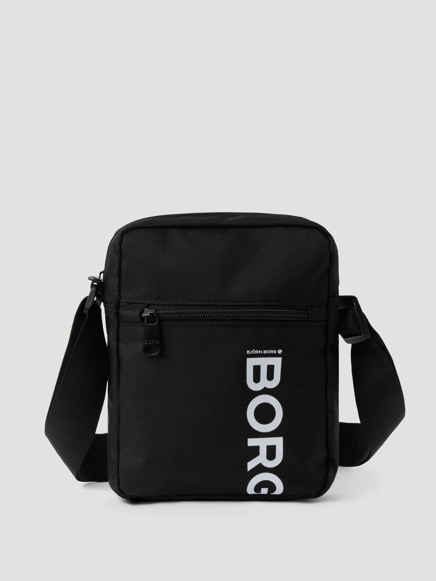 Front view of the black Björn Borg Core Crossover Bag 1,7L featuring a white logo and durable polyester material. - Image 1