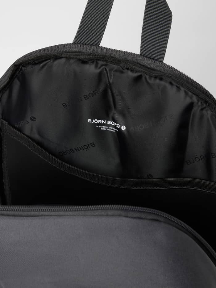 Interior view of the Björn Borg Core Iconic Backpack 25L in Asphalt (Grey) featuring the digital sleeve and white logo. - Image 4