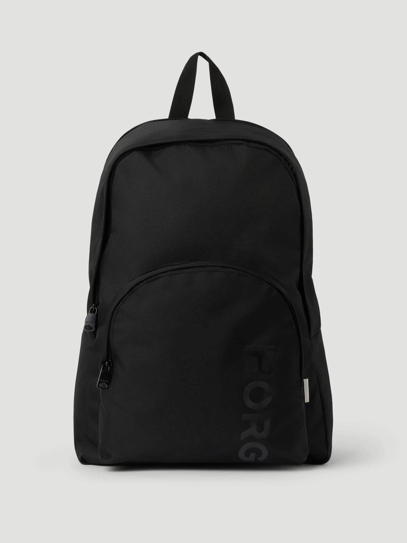 Front view of the black Björn Borg CORE ICONIC BACKPACK 17L featuring a large vertical logo and recycled material. - Image 1