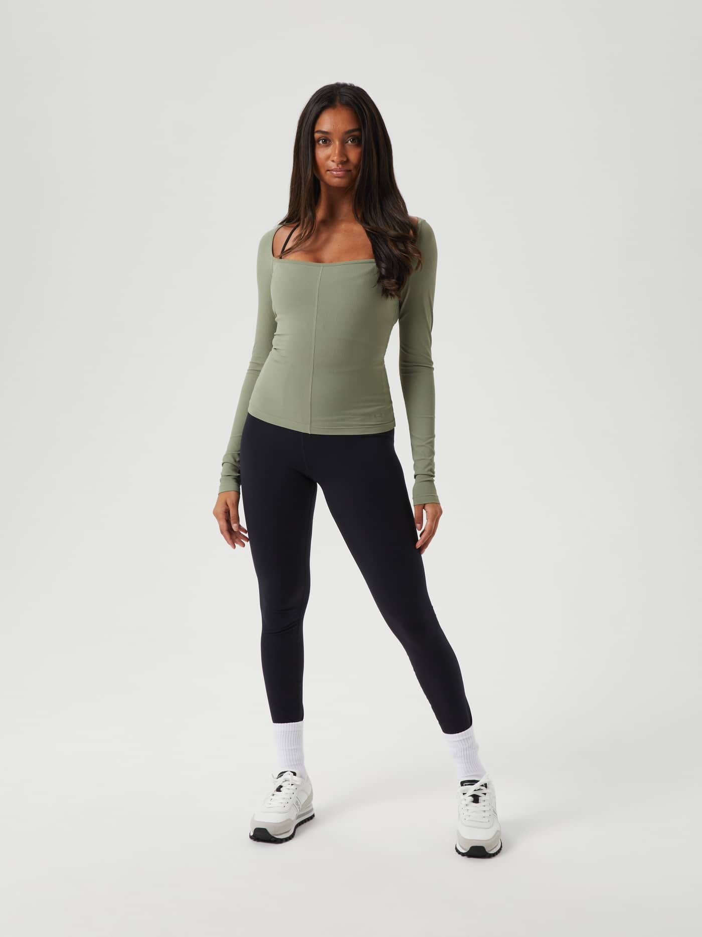 Full-body front view of a model in the slim-fit Studio Ballerina Long Sleeve in Vetiver (Green) for performance training. - Image 3