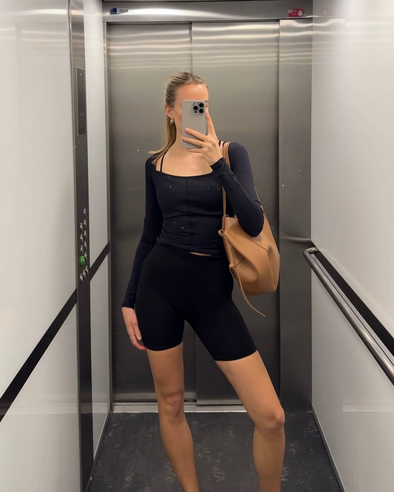 Front view of a woman in the slim-fit Björn Borg Studio Ballerina Long Sleeve in Black Beauty (Black) for training. - Image 6