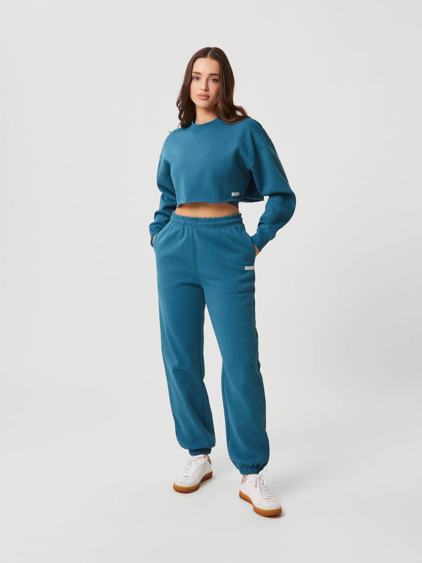 Front view of a woman in the Mallard Blue (Blue) Studio Oversized Cropped Crew, a soft cotton sweater with a stylish fit. - Image 4