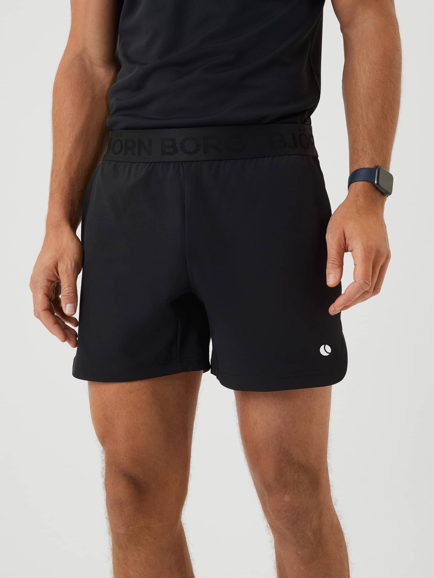 Front view of the Björn Borg Ace Short Shorts in Black Beauty (Black) with a white tennis-ball logo for training. - Image 2
