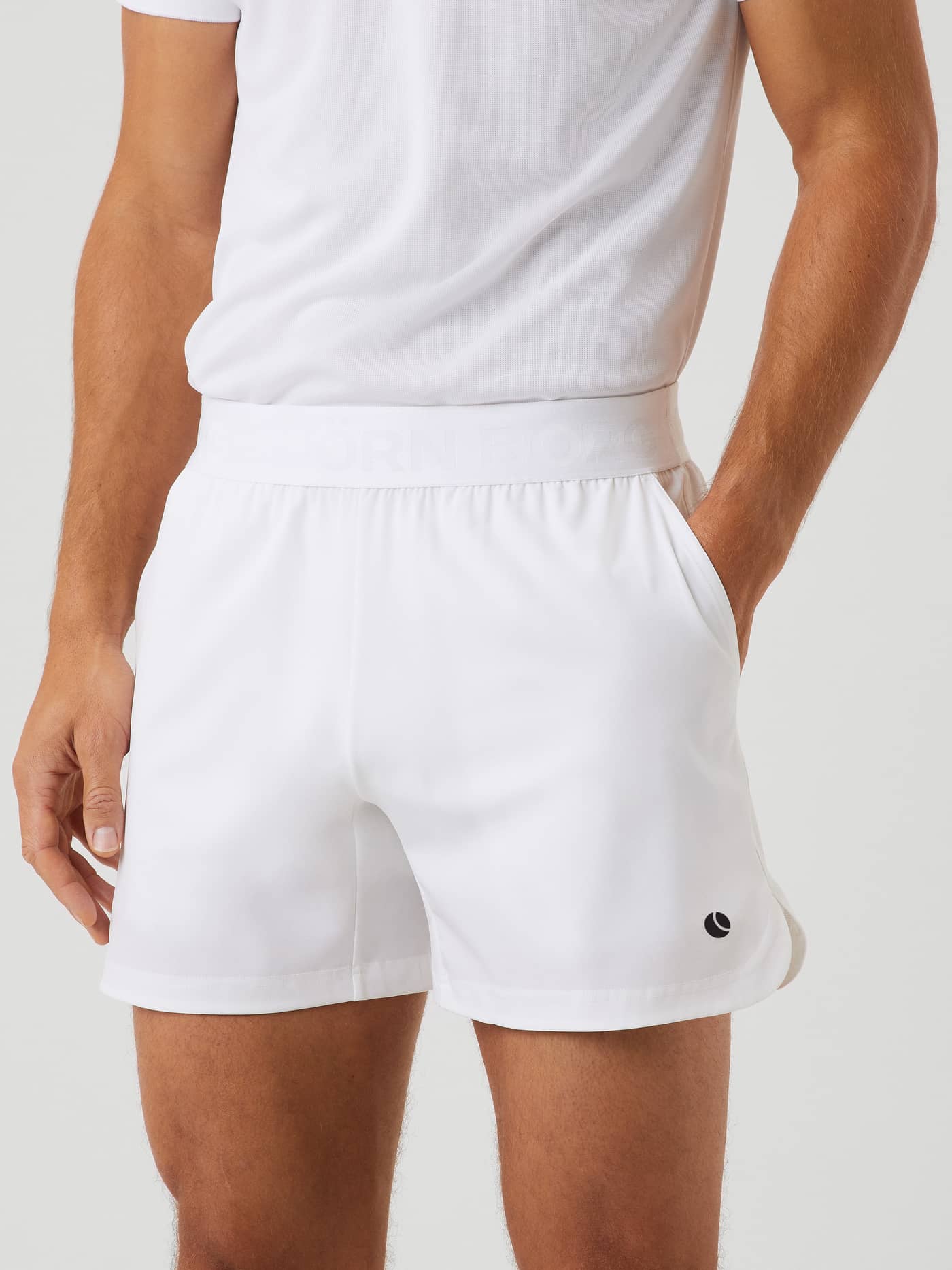 Front view of a man wearing the Björn Borg Ace Short Shorts in Brilliant White (White) for training and tennis. - Image 2
