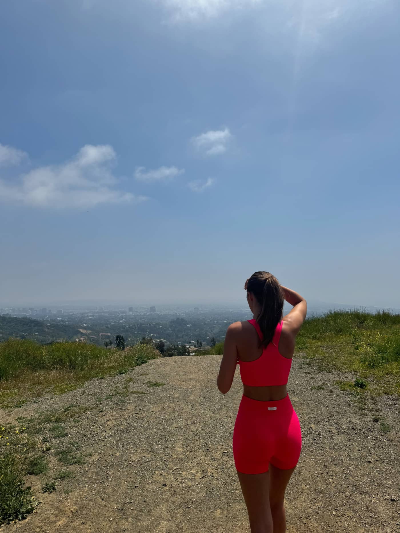 Back view of a woman wearing Diva Pink (Pink) Studio Seamless Rib Shorts, designed for training with a slim, ribbed fit. - Image 8