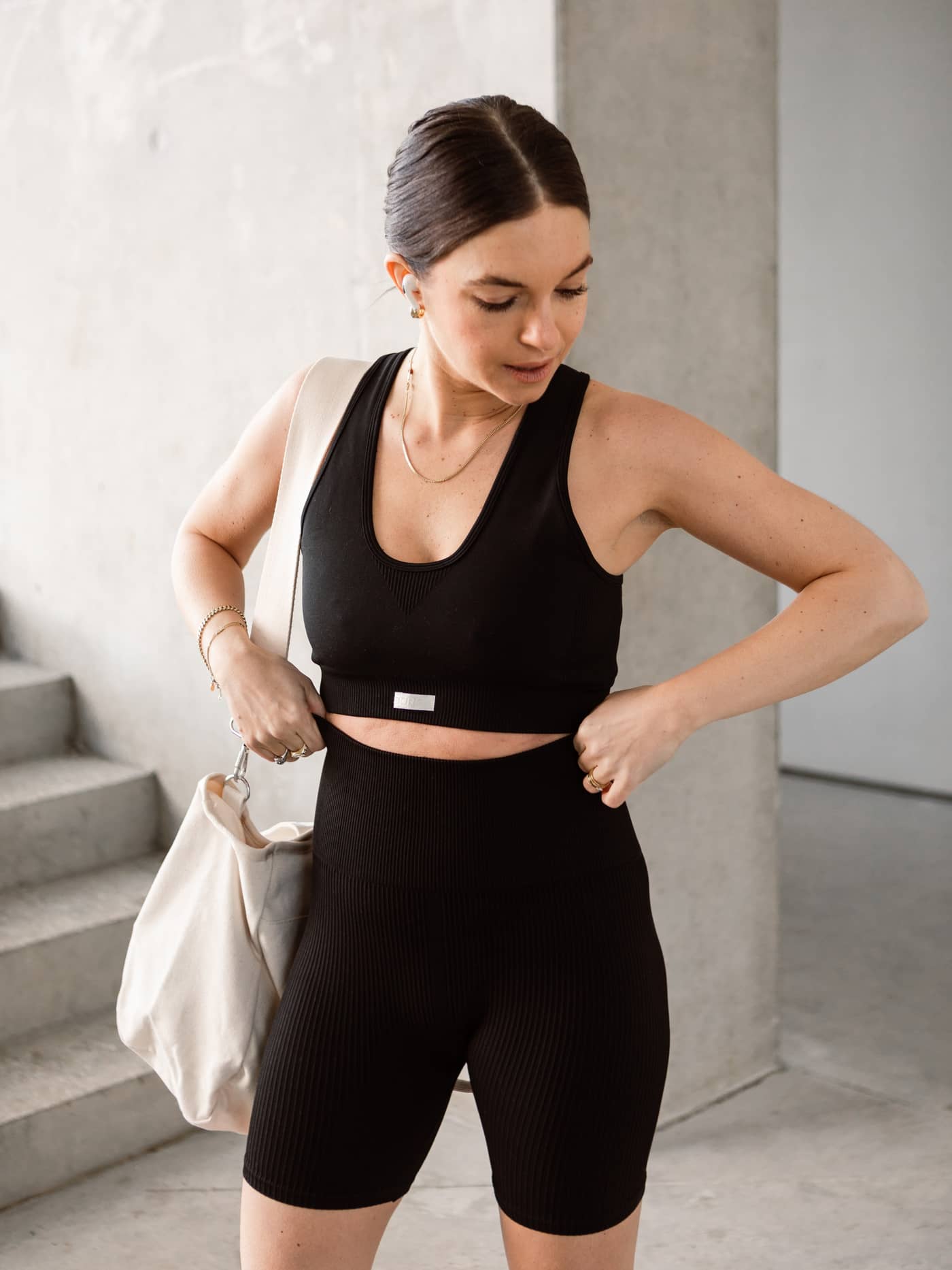 Model wearing the Studio Seamless Rib Shorts in Black Beauty (Black) for a slim-fit ribbed training style. - Image 2
