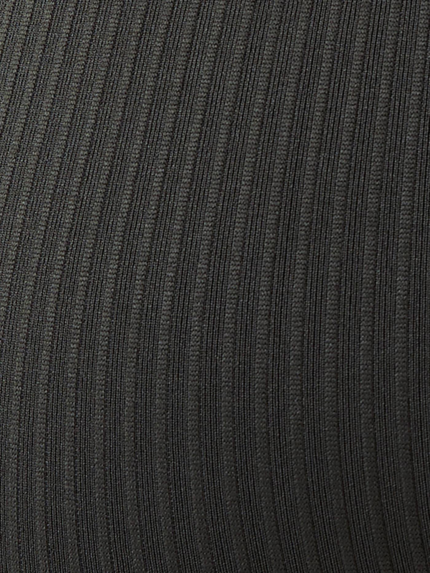 Detailed close-up of the rib-knitted seamless training fabric on the Studio Seamless Rib Tights in Peat (Green). - Image 6