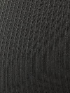 Detailed close-up of the rib-knitted seamless training fabric on the Studio Seamless Rib Tights in Peat (Green). - Image 6