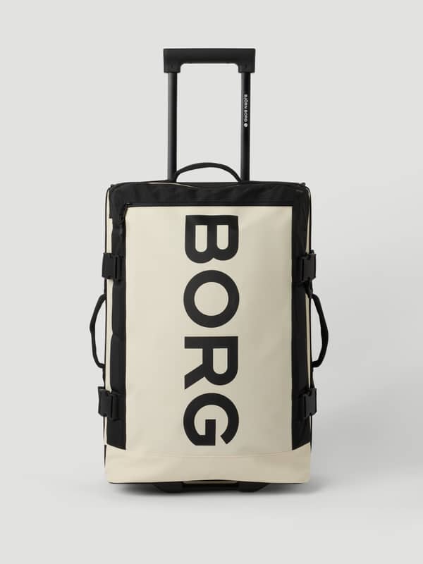 Borg Travel Trolley S - 46L i Bone White (Vit) sedd framifrån med en stor svart logotyp och ett utfällt handtag.