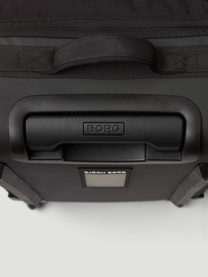 Detail van de handvatten en het stevige materiaal van de Borg Travel Trolley S - 46L in Black Beauty (Zwart). - Image 5