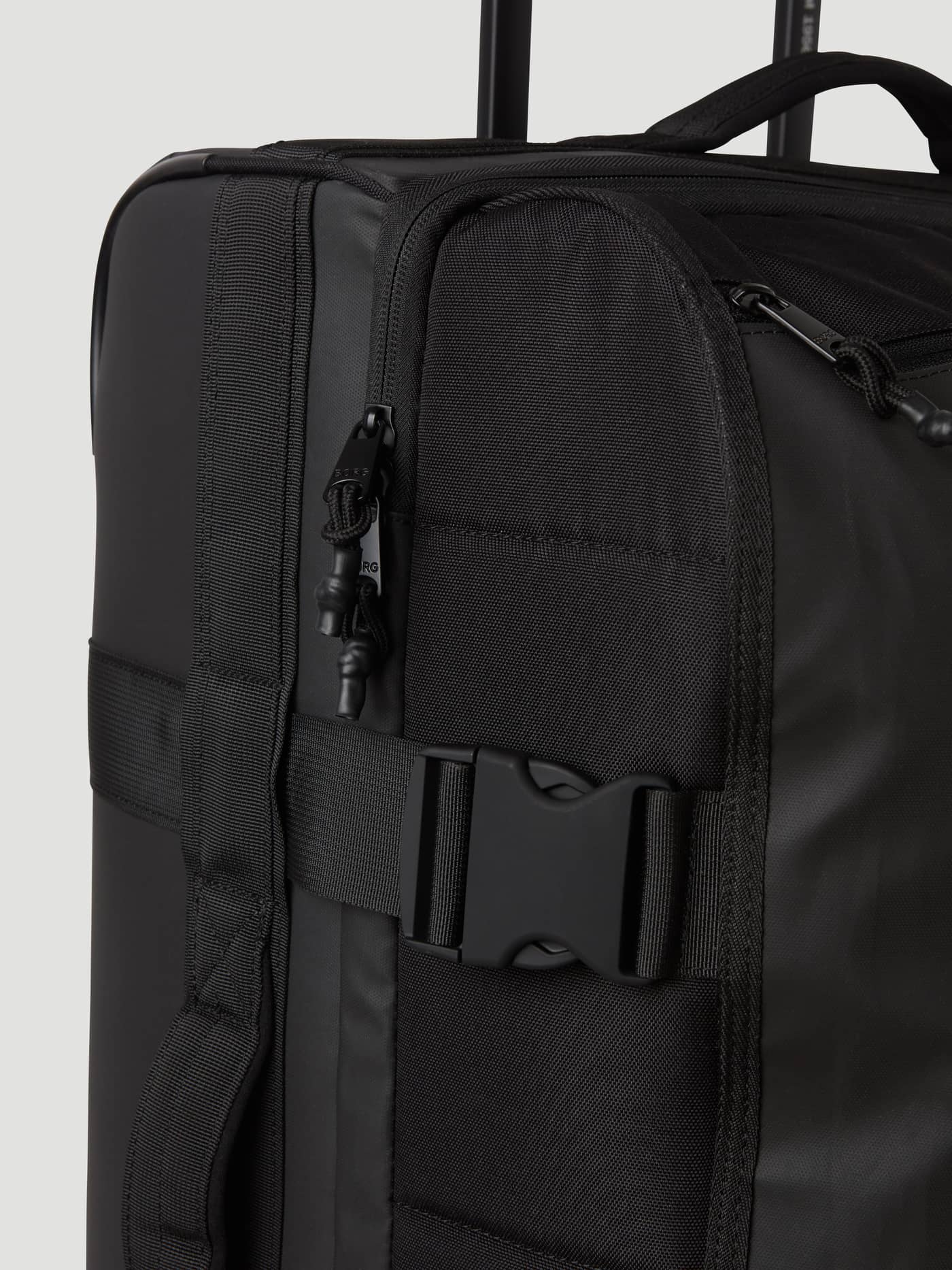 Detailed view of the Björn Borg Travel Trolley S - 46L in Black Beauty (Black) showing the zippers and side buckle. - Image 12