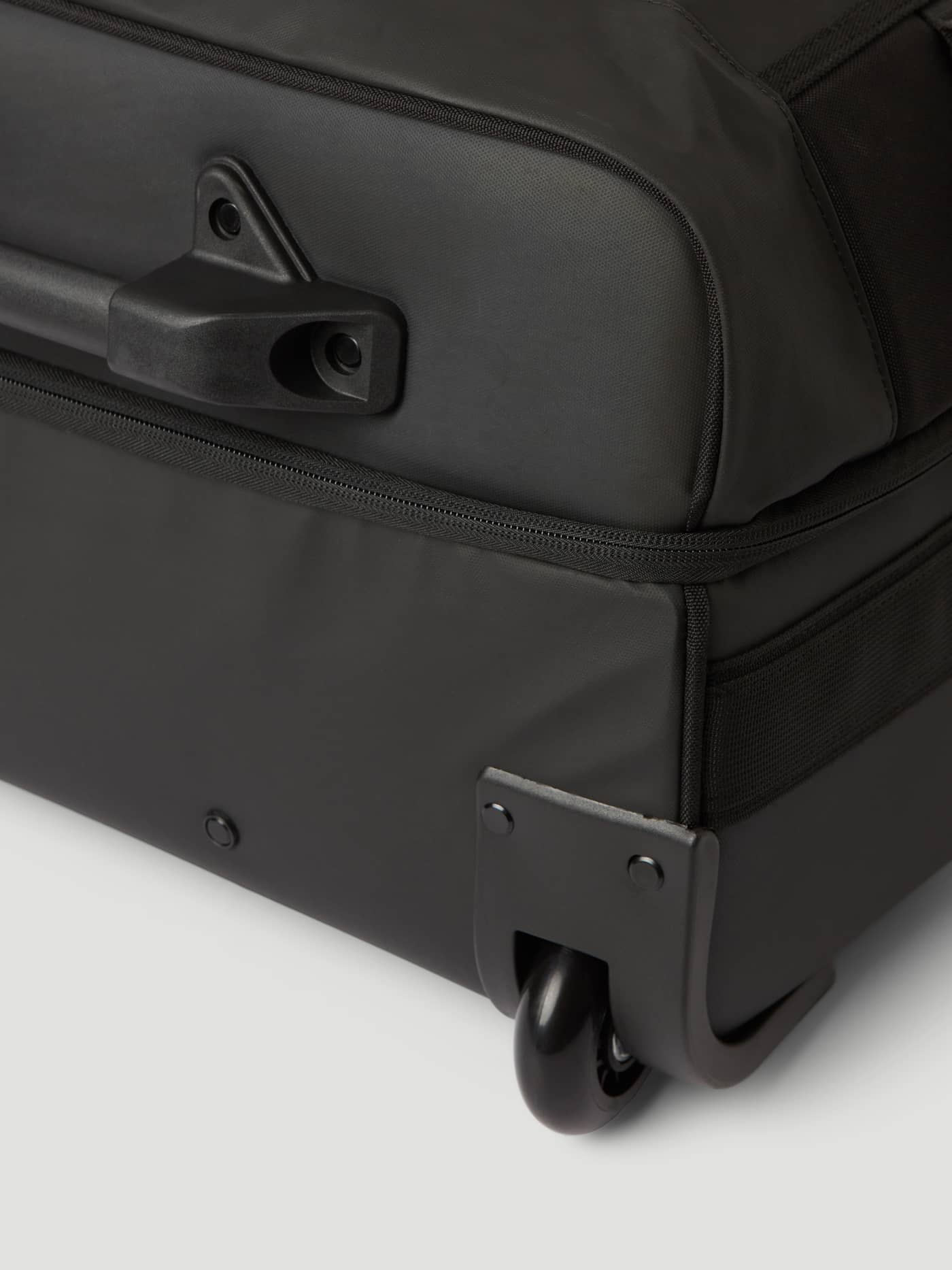 Durable TPE-coated material and wheel detail on the Borg Travel Trolley S - 46L in Black Beauty (Black). - Image 10