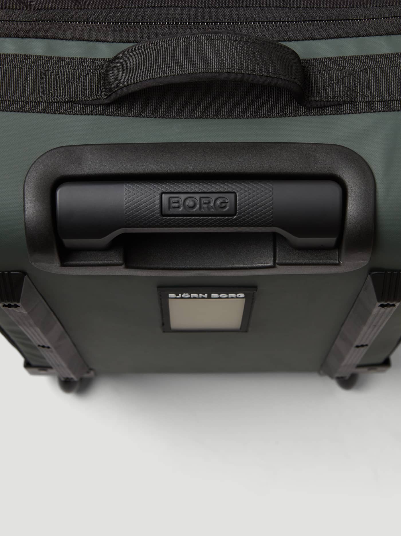 Top view of the Borg Travel Trolley S - 46L in Mountain View (Green), featuring the sturdy handle and black BORG logo. - Image 7