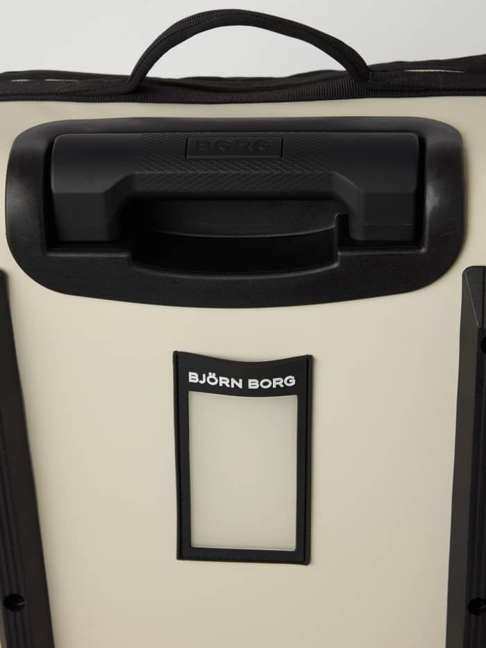 Zwarte handgrepen en een bagagelabel met wit logo op de Bone White (Wit) Borg Travel Trolley S - 46L. - Image 5