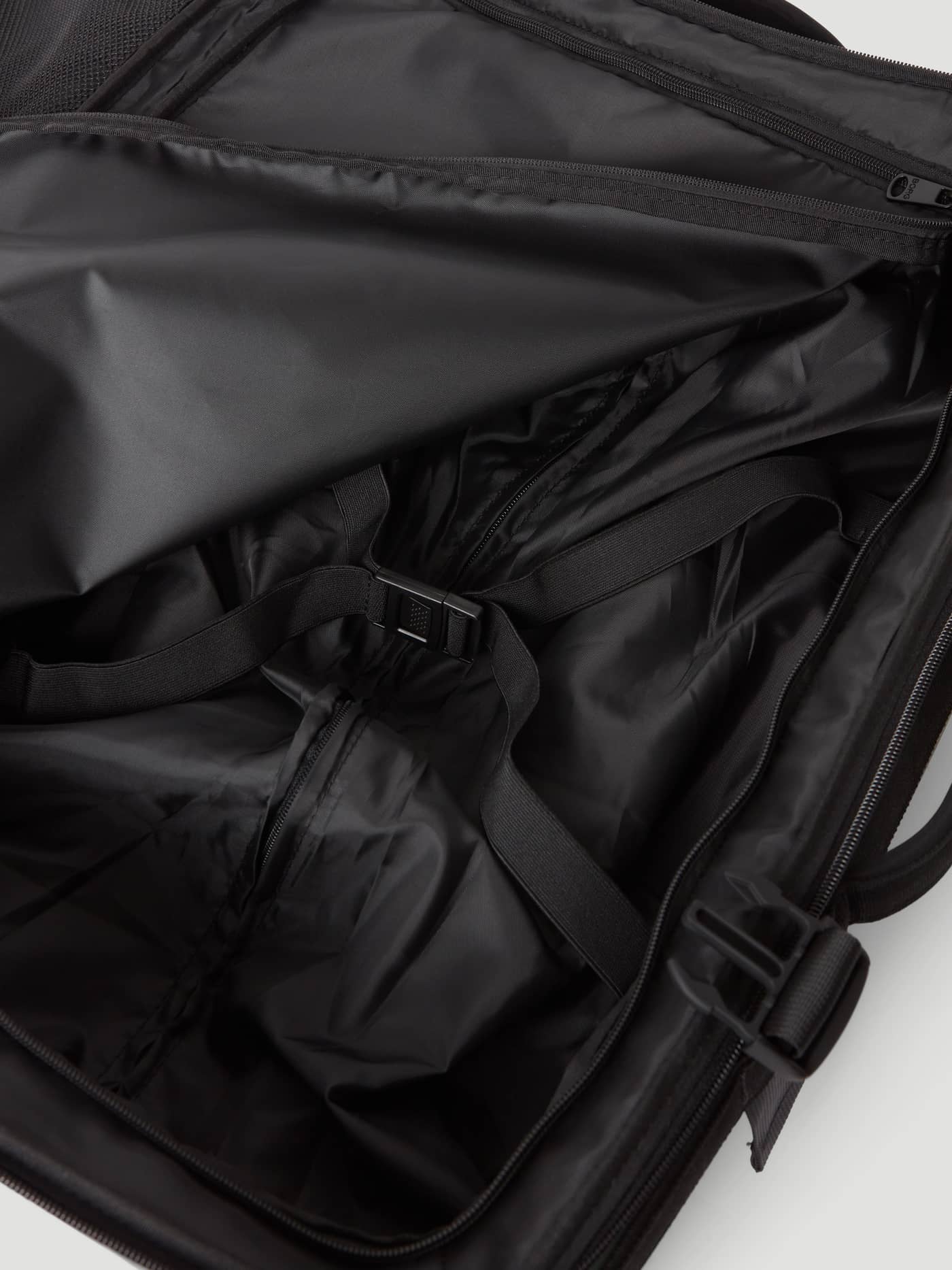 Detailed interior view of the Borg Travel Trolley S - 46L in Green with black lining and an adjustable buckle strap. - Image 6