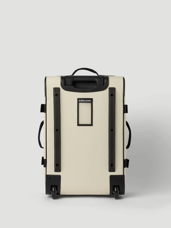 Achteraanzicht van de Borg Travel Trolley S - 46L in Bone White (Wit) met zwarte rails en wielen. - Image 4