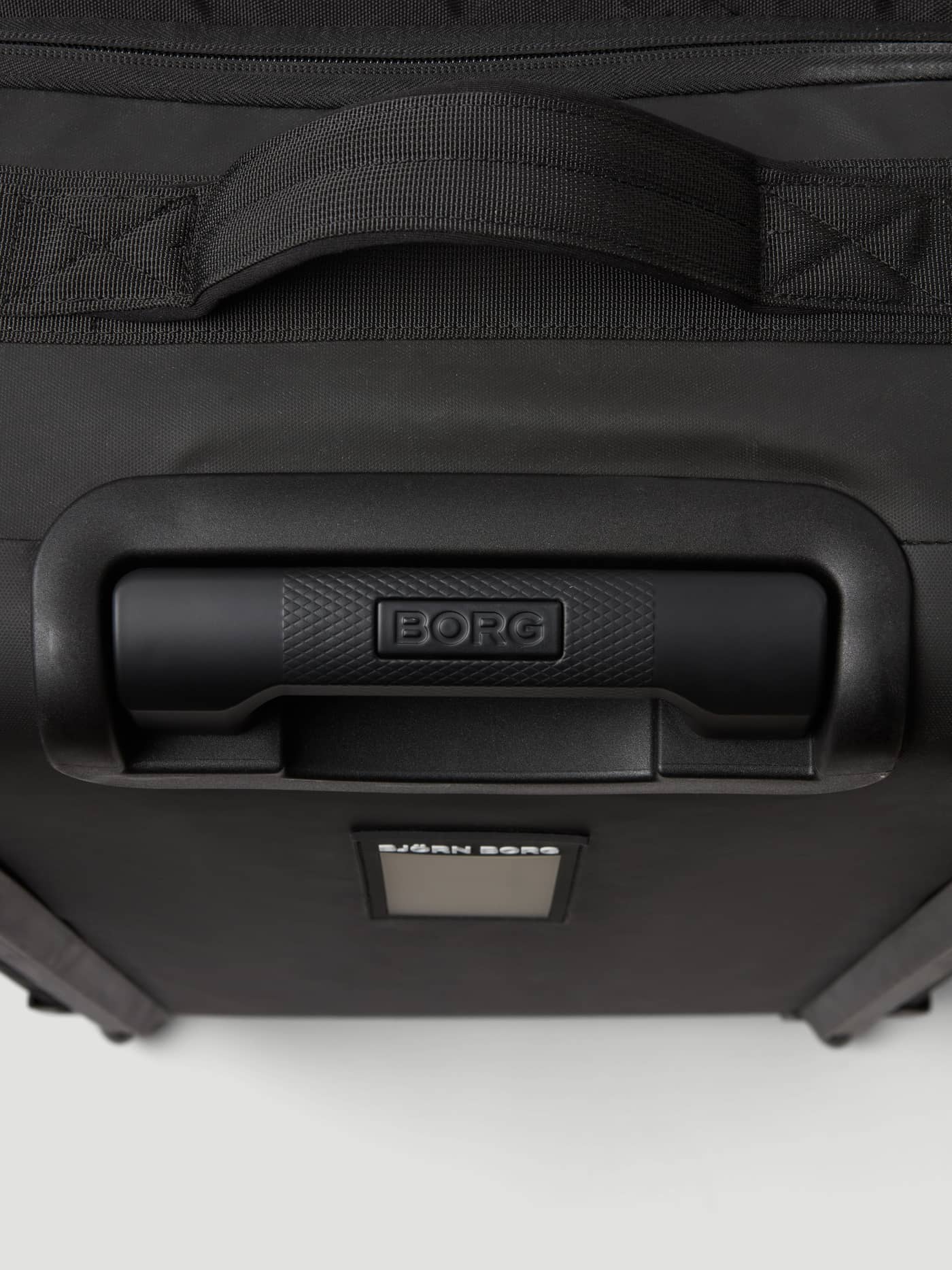 Detailed view of the Borg Travel Trolley L - 80L in Black Beauty (Black) with the sturdy expandable handle and black logo. - Image 8