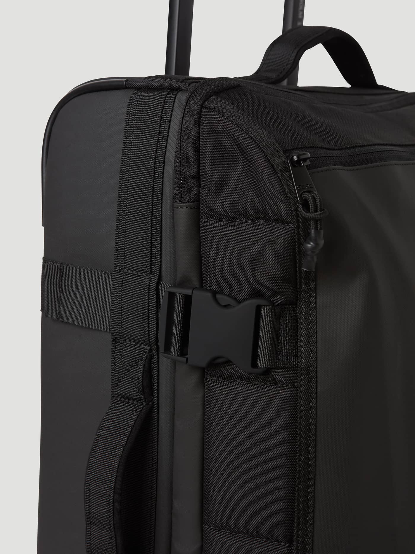 Close-up of the side buckle and TPE-coated material on the Borg Travel Trolley L - 80L in Black Beauty (Black). - Image 11