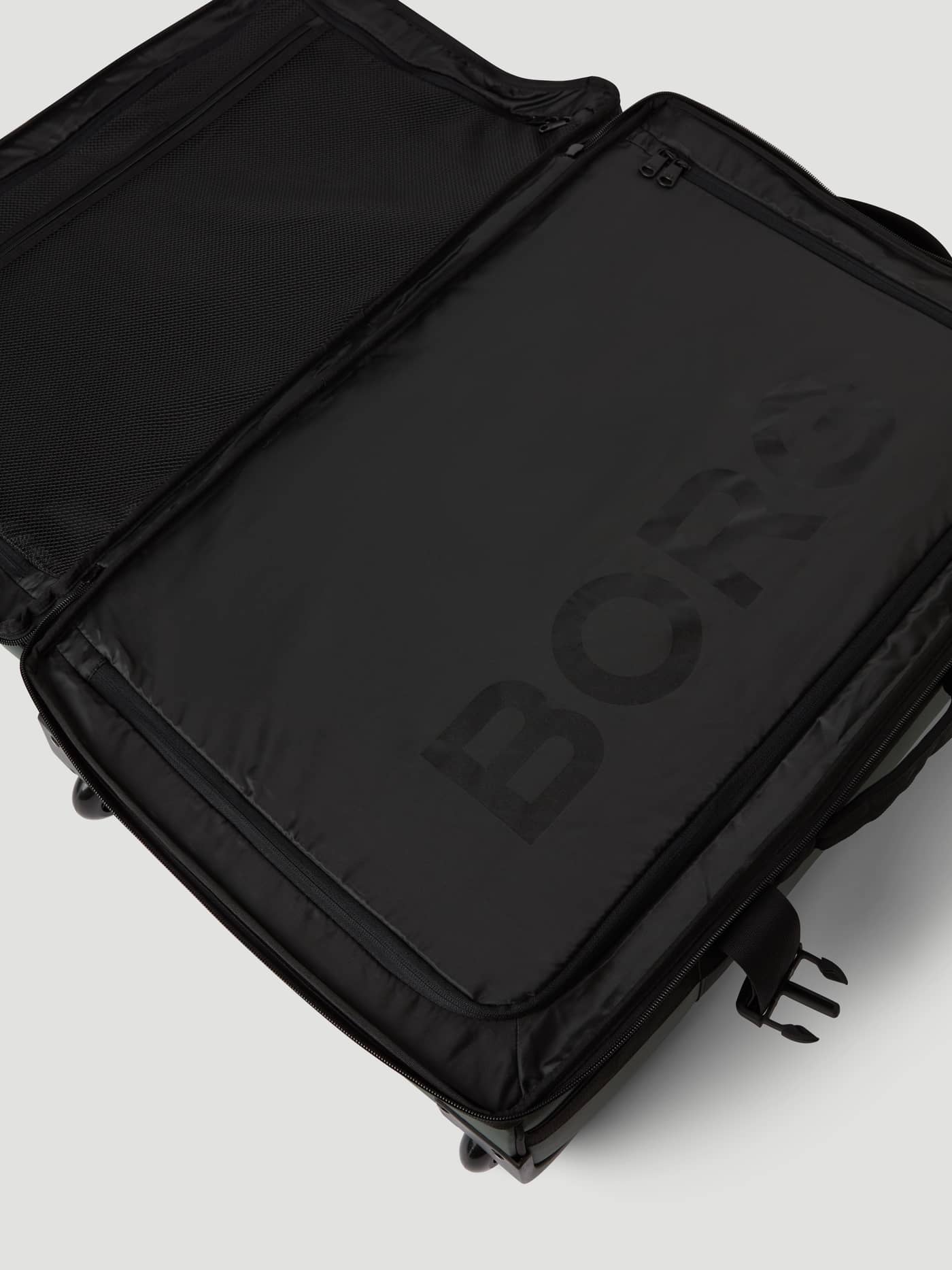Borg Travel Trolley L - 80L in Green in der Innenansicht mit Reißverschlussfächern und großem Logo in Tonal Black. - Image 8