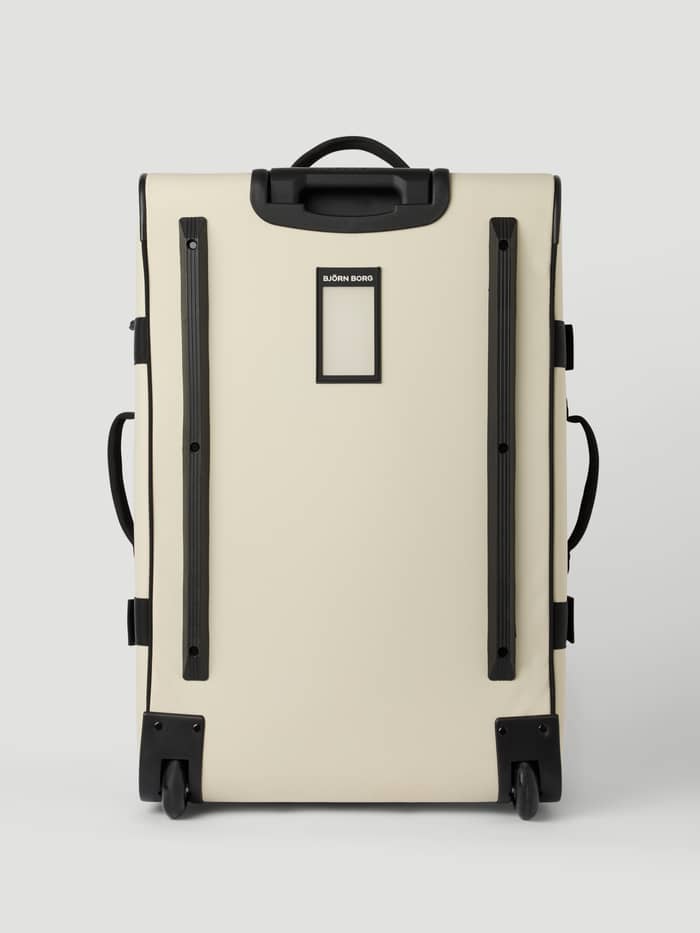 Achteraanzicht van de duurzame Borg Travel Trolley L - 80L in Bone White (Wit) met wieltjes en beschermende rails. - Image 5