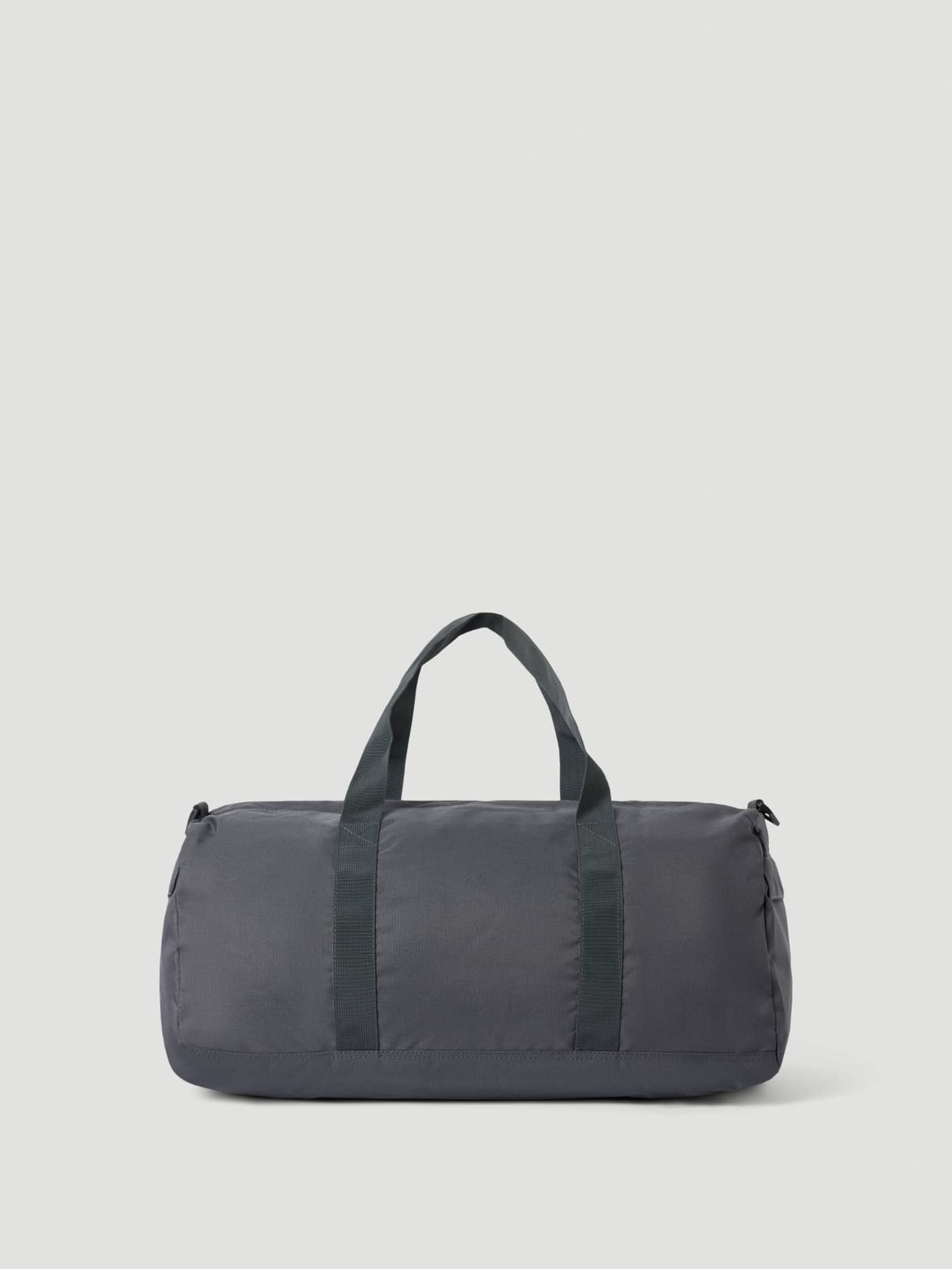 Vue de profil du Core Sports Bag 31L en Asphalt (Gris), un sac d'entraînement robuste en polyester recyclé. - Image 2