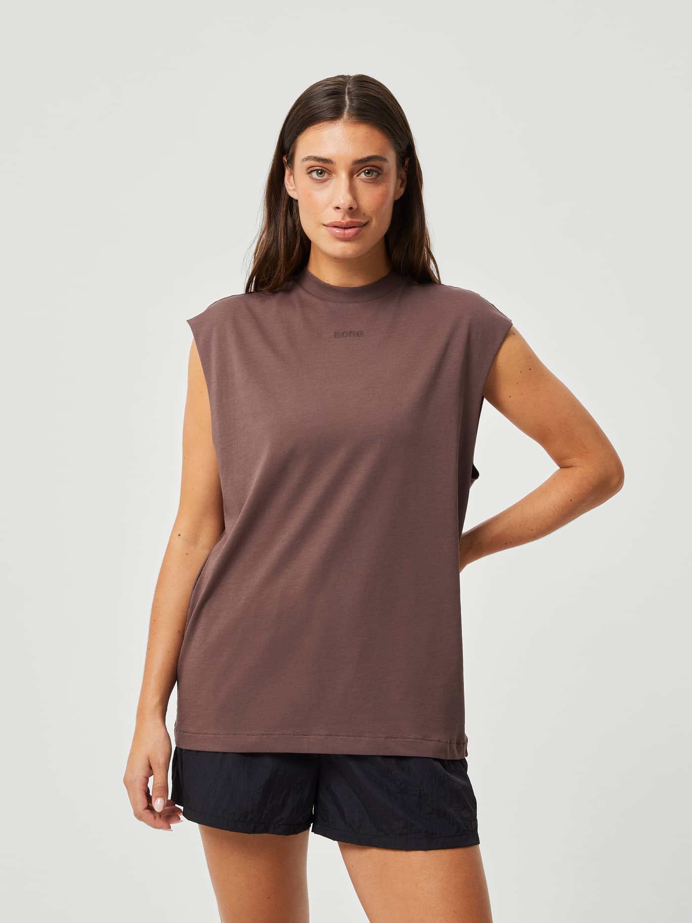 Front view of the Björn Borg Studio Loose Fit Tank in French Toast (Brown), a loose training top with a tonal chest logo. - Image 1