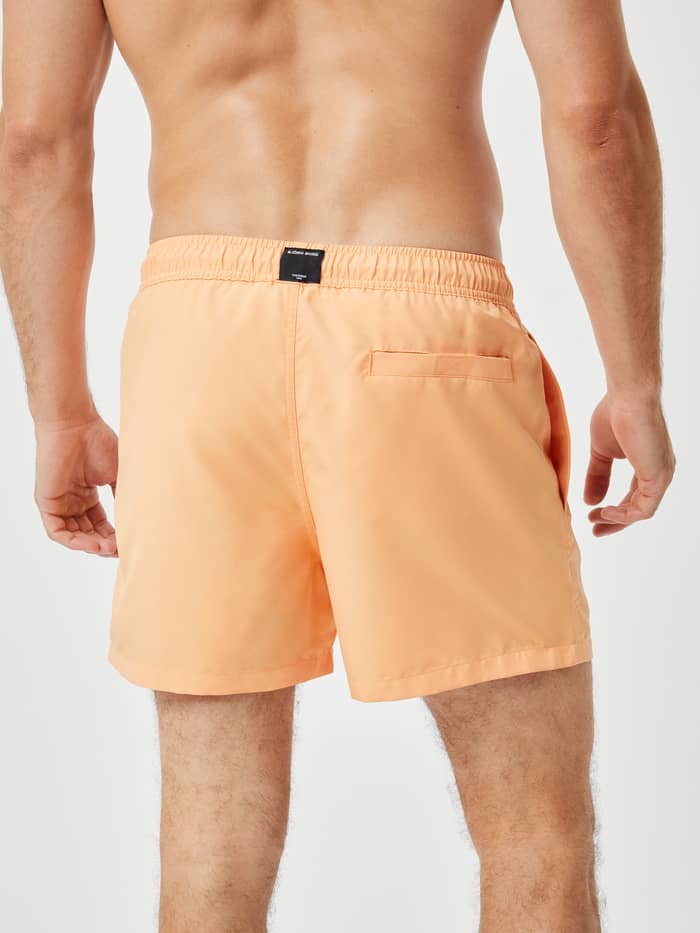Borg Solid Swim Shorts in Orange Chiffon (Oranje) van polyester met een achterzak met klittenband in achteraanzicht. - Image 3