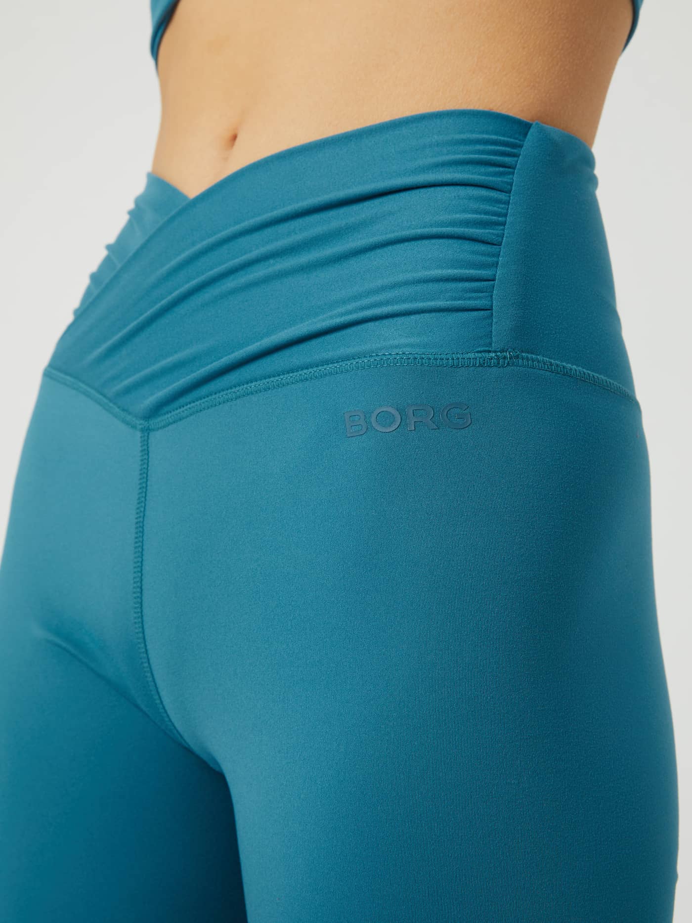Mallard Blue (Blue) Studio Cross Shorts for women with a high waist overlap and tonal Borg logo for a stylish training fit. - Image 4