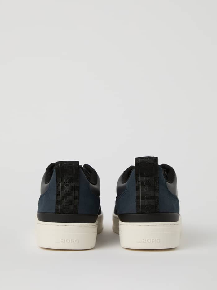 Back view of the Björn Borg Men’s Sneakers T1055 in Navy, featuring functional PU leather and white tennis logo soles. - Image 3